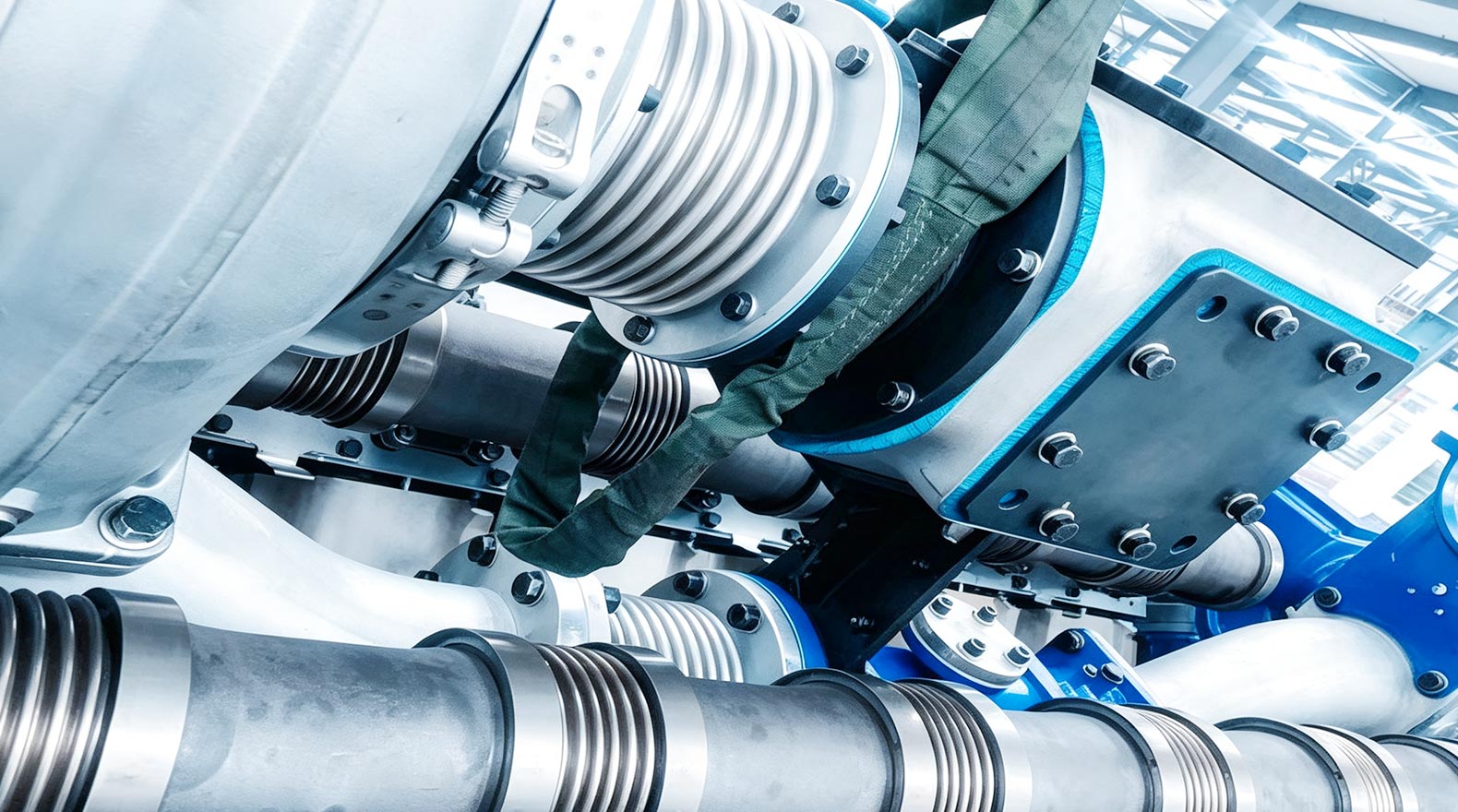 Industrial piping system with metal expansion joints